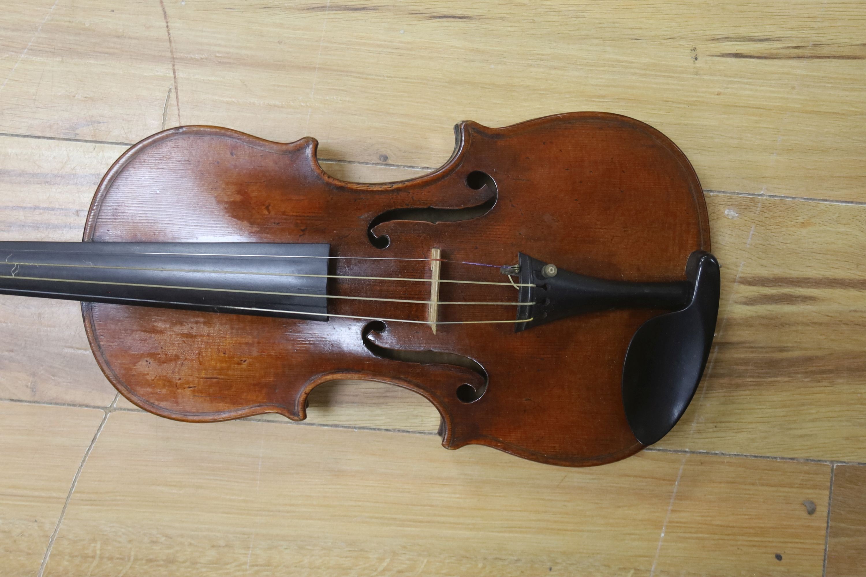 A cased violin and bow